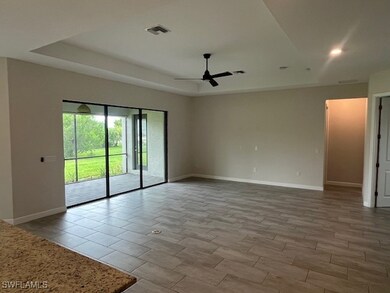 Spare room featuring a ceiling fan, baseboards, a