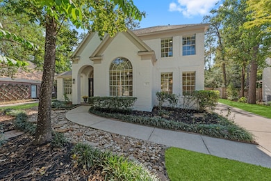 This inviting setting with lush greenery along with blooming red rose bushes creates a beautiful welcome every time you arrive.
