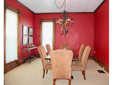Formal dining room with crown molding.
