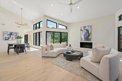 Living room featuring recessed lighting, a high c