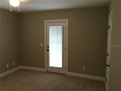 Master Bedroom w/ door to back patio