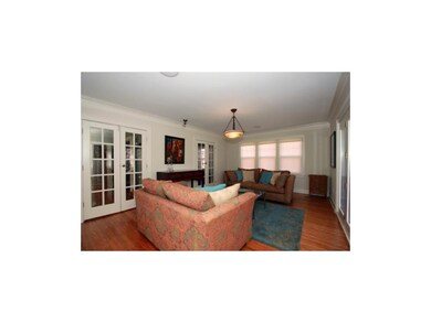 Two sets of French doors lead to the first floor b