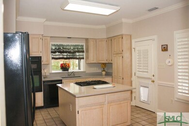 KITCHEN WITH BACKDOOR W/OVERHANG FACING GARAGE