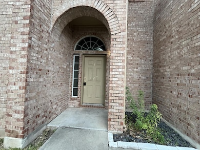 Property entrance with brick siding