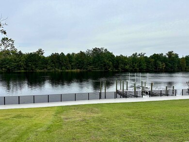 Exterior space with a lawn and a water view
