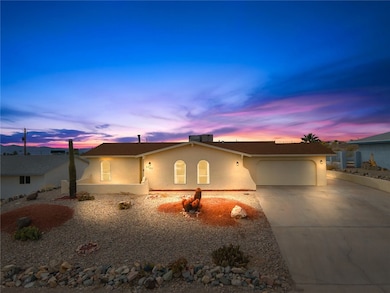 Single story home featuring an attached garage, st