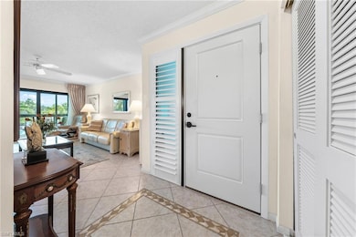 Entryway featuring light tile patterned%2