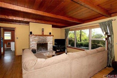 Wood burning fireplace, wood beamed ceilings and s