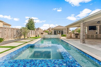 This photo showcases a luxurious backyard with a m