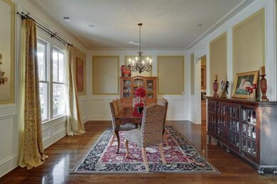 Fantastic millwork with decorative shadow boxes and crown molding throughout the dining room.