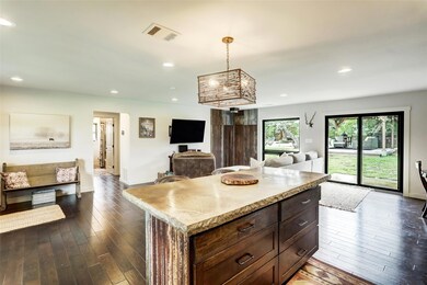 Kitchen featuring open floor plan, visible vents,