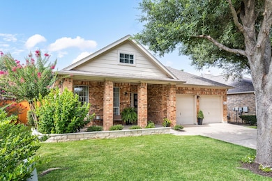 View of front of home with brick siding, a front 