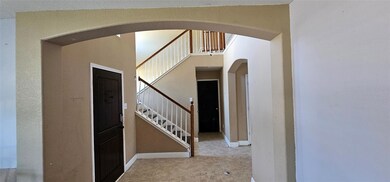 Unfurnished living room featuring hardwood / wood-