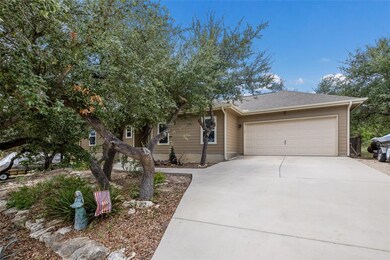 View of front facade with an attached garage, concrete driveway, and a shingled roof