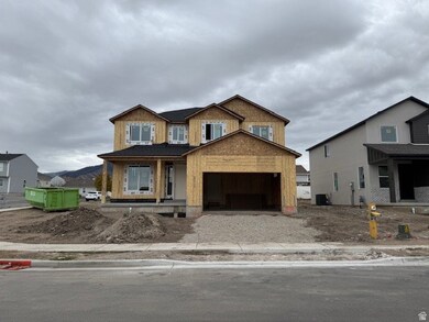 Unfinished property featuring a porch and a garage