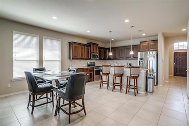 Dining room featuring baseboards, visible vents, r