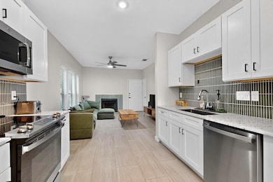 Kitchen with stainless steel appliances, a ceilin