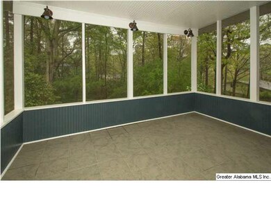 Fantastic screened porch with tile floor and beadb