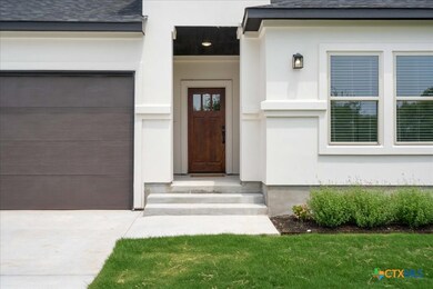 Exterior steps lead to a secluded front porch and
