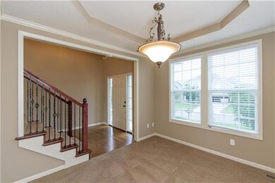 Formal dining room with accented ceiling.