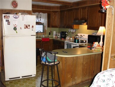 Large kitchen area with peninsula overlooking dini