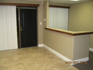 View of front door and reception desk.