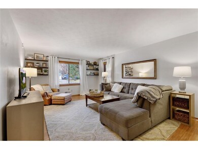 The handsome living room offers hardwood floors an