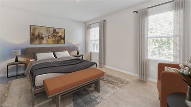 Bedroom featuring carpet flooring and baseboards