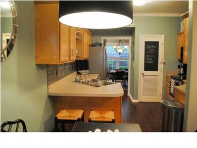 Hang out on the barstools while someone is cooking
