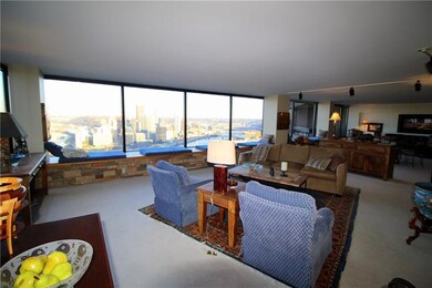 The great room has entrances to a balcony and larg