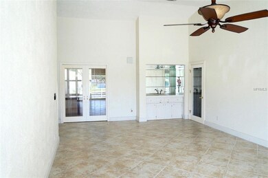 Living room with wet bar and office/den
