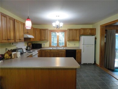 Spacious kitchen with peninsula that...