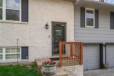 View of exterior entry with a garage