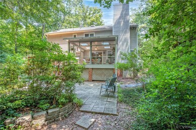 Back yard patio looking back at screened porch and
