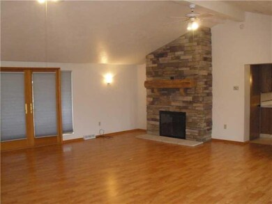 Great Room. Stone woodburning fireplace in family 