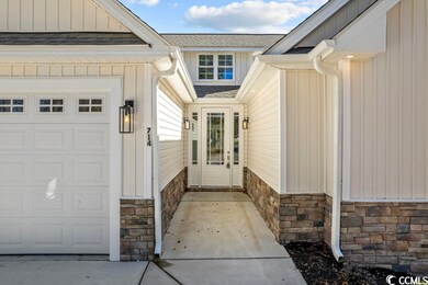 This homes front entrance features a glass front d