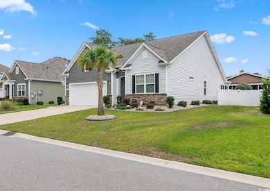 View of front facade featuring concrete driveway, an attached garage, and stone siding