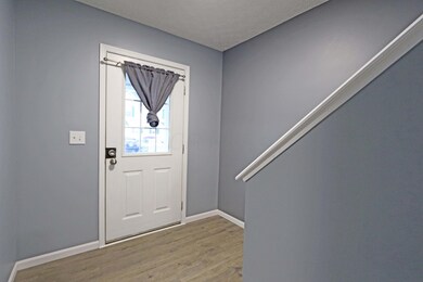 Foyer with wood laminate flooring