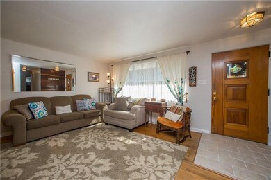 The living room is light and airy and has direct a