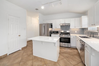 Kitchen with stainless steel appliances, tasteful