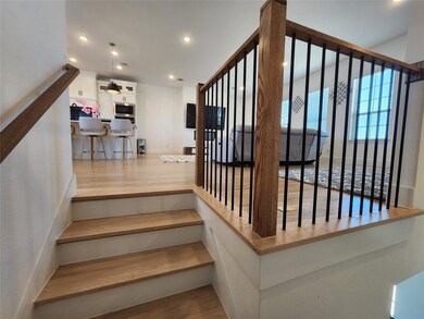 View walking up to living area from first floor