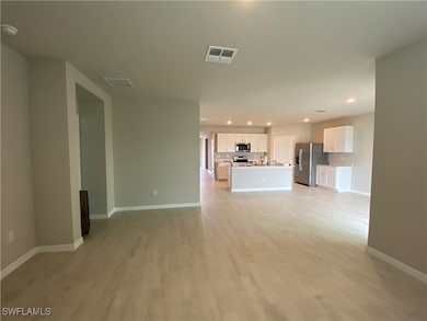 Unfurnished living room featuring light wood-type