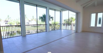 Spare room with beamed ceiling and baseboards
