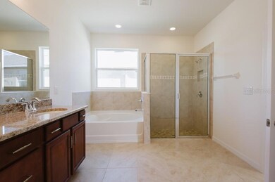 Primary bathroom has dual sins, tub and separate shower