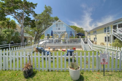 Rear view of property featuring a deck