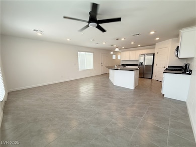 Kitchen with stainless steel appliances, dark coun