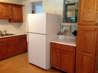 Kitchen from the deck.  Warm wood cabinets and woo