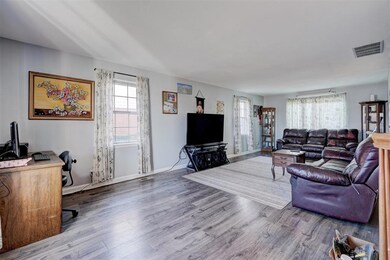 Living room featuring hardwood / wood-style floori