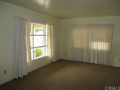 Living Room with nice big windows letting that nat