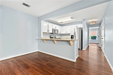 The kitchen has been updated with granite countert